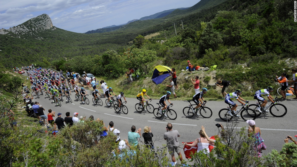 Fans cheer on cyclists participating in the 2012 Tour de France on Saturday, July 14. 