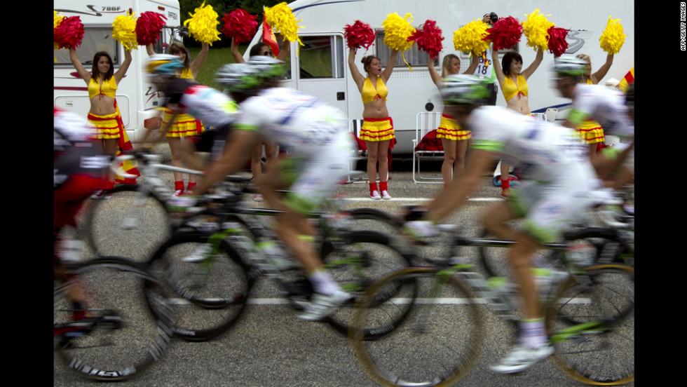 Cheerleaders from the Perpignan rugby club cheer on riders Sunday.