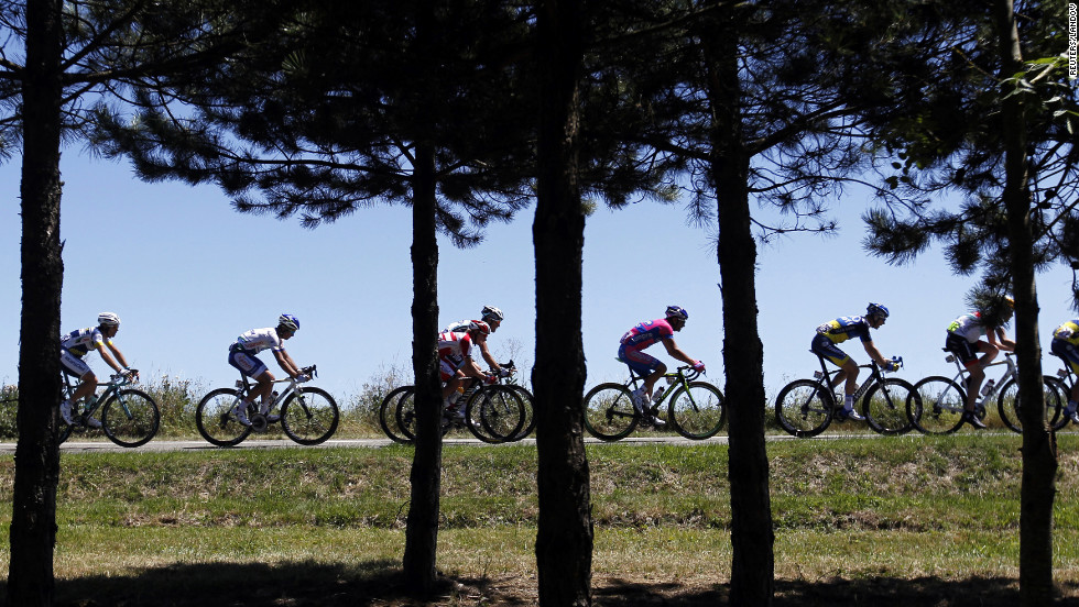 The main pack of riders pass through the French countryside during Monday&#39;s course.