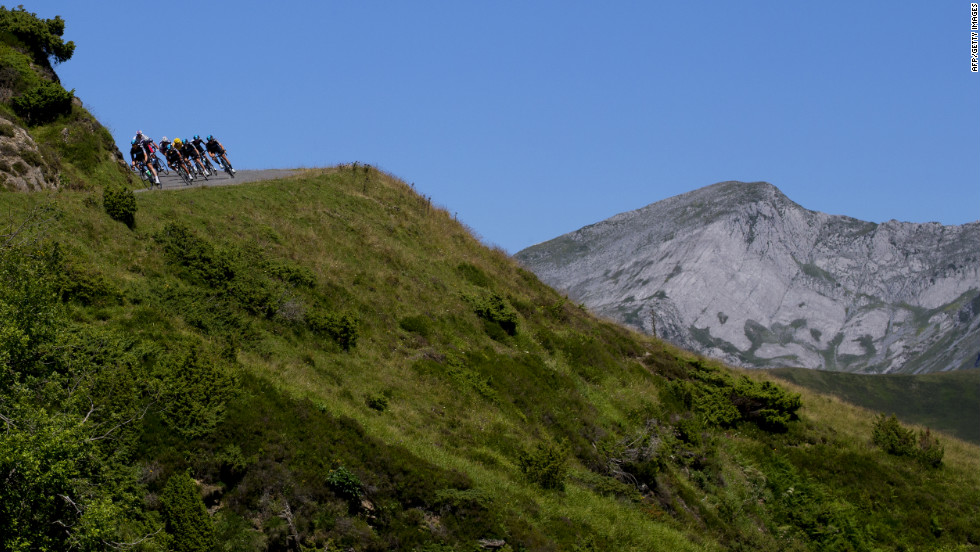 Riders round a treacherous turn on stage 16 Wednesday.