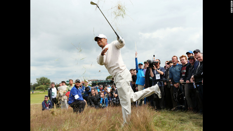 Tiger Woods makes a tough shot from the rough during the first round of the British Open on Thursday, July 19. Woods finished the Round 3 under par at 67. 