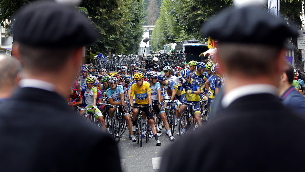 Tour de France riders wait before the start of the 17th stage of the race on Thursday.