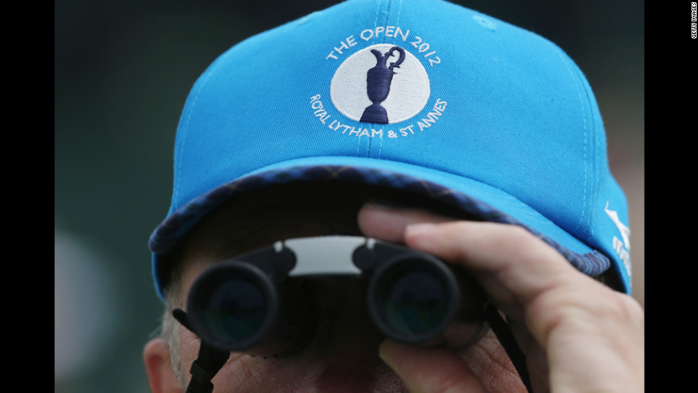  A fan keeps an eye on first-round action Thursday.