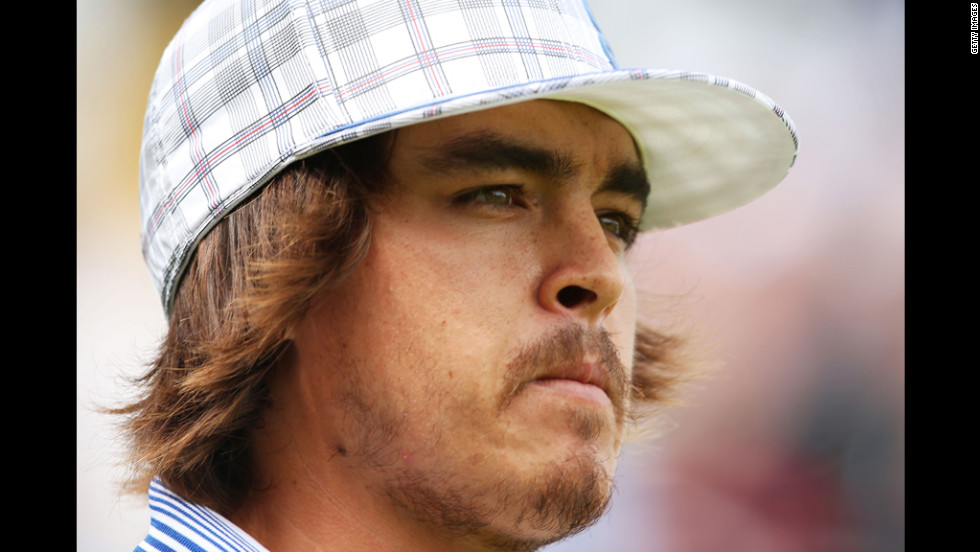 Rickie Fowler of the United States walks off the first tee Thursday.