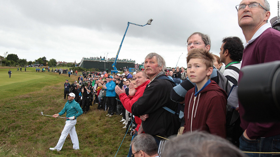 Spectators lean in to follow a shot out of the rough from Garcia on Thursday.