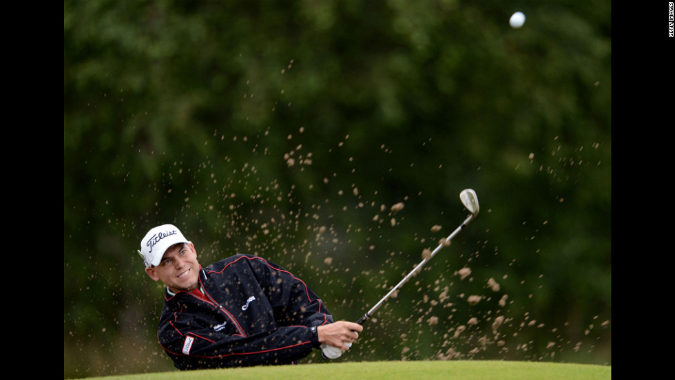 Bill Haas of the United States plays a shot from a bunker Thursday.