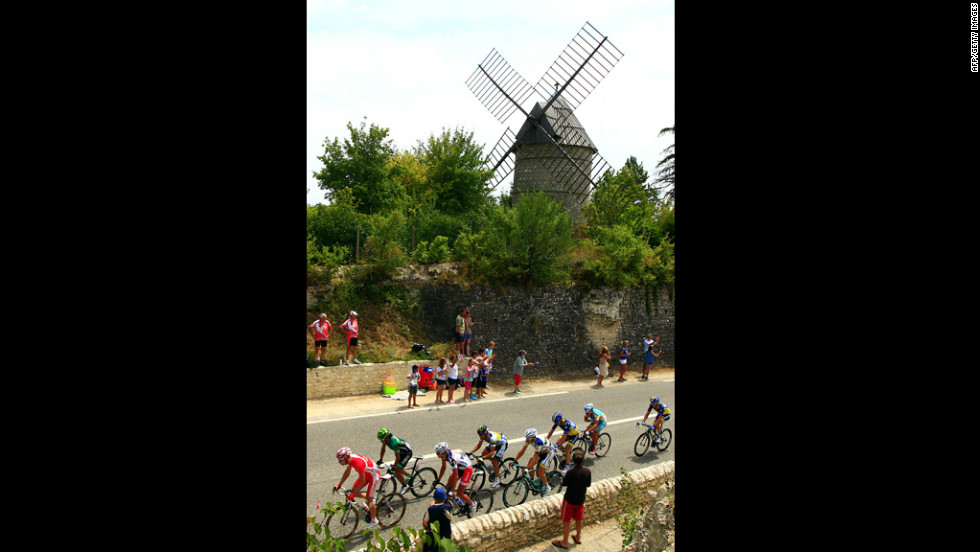 The leaders cruise past a windmill Friday on the 18th stage of the Tour de France. 