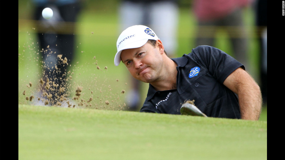 Richard Sterne of South Africa hits from a greenside bunker on the 11th hole during the second round Friday.