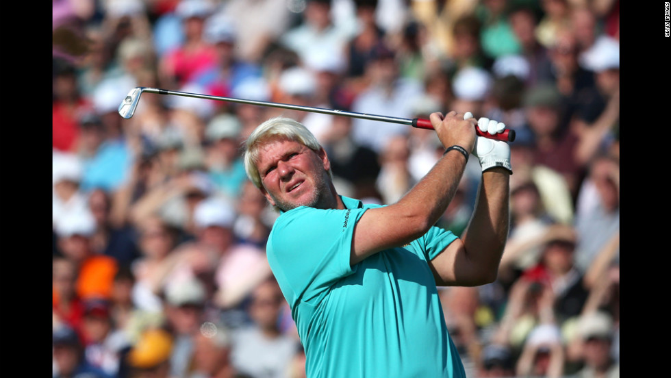 American John Daly swings at the fifth hole. Daly, who won the Open in 1995, struggled to a 77 Saturday and is in next-to-last place.