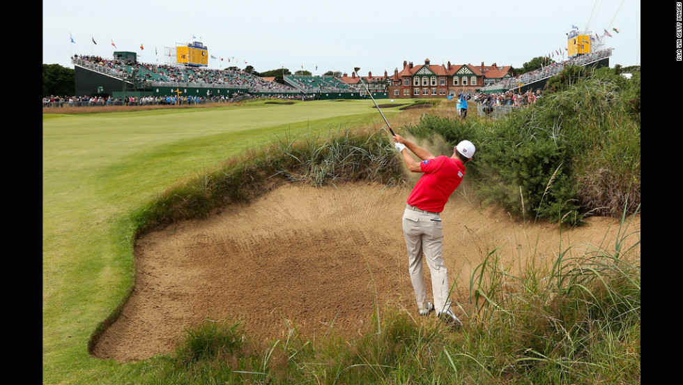 Ireland&#39;s Padraig Harrington blasts from a bunker on the 18th hole Saturday.