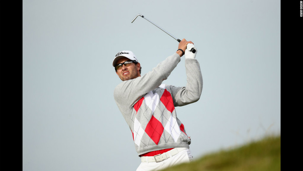 Adam Scott of Australia hits an approach shot on Saturday, July 21, at Royal Lytham &amp;amp; St. Annes Golf Club in England during the third round of the British Open on Saturday. Scott finished with a four-shot lead going into the final round of golf&#39;s oldest major championship 