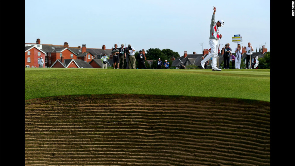 Adam Scott celebrates making a putt for birdie on the eighth hole.