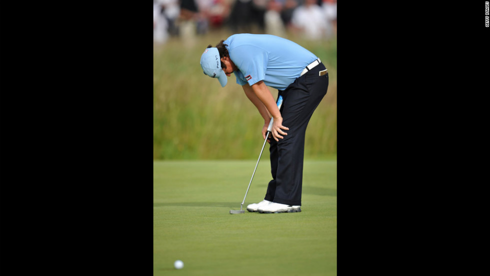 Jason Dufner of the United States reacts to a missed putt on the 17th green. Dufner struggled to shoot 73 on Saturday and is 10 shots out of the lead.