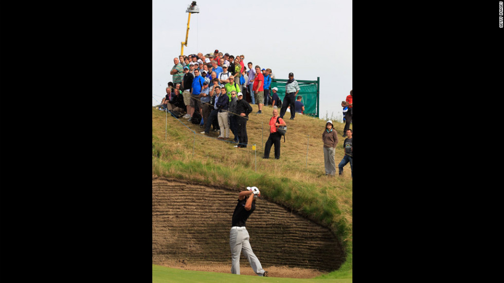 Spectators watch Olesen extract himself from one of Royal Lytham &amp;amp; St. Annes&#39; many bunkers on Saturday.