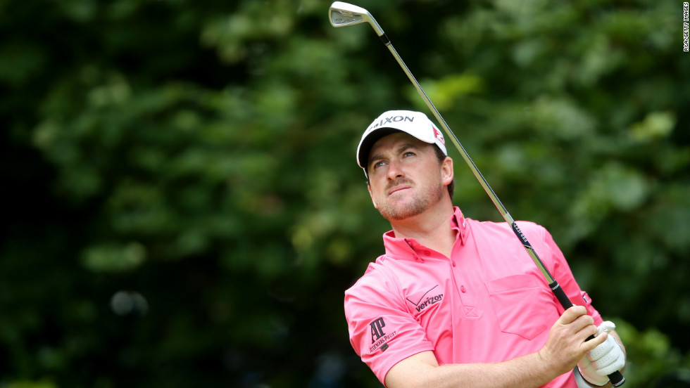 McDowell tees off on the first hole Sunday.