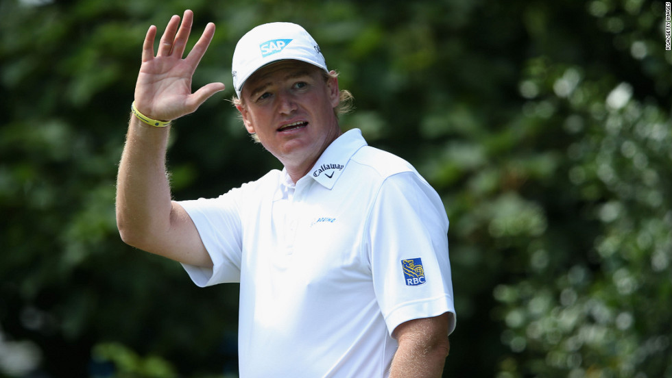 Ernie Els of South Africa, who began the day at -5, waves to spectators from the the on the first hole as he begins the final round Sunday.