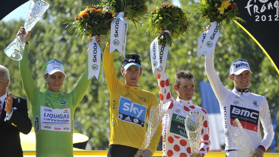 From left, best sprinter Peter Sagan of Slovakia, overall race winner Bradley Wiggins of Great Britain, best climber Thomas Voeckler of France and best young rider Tejay Van Garderen of the United States celebrate on the podium after finishing the final stage of the Tour de France in Paris on Sunday.