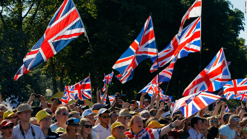 British fans celebrate during the 20th and final stage of the Tour on Sunday in Paris.