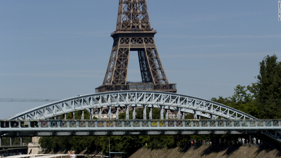 The peloton rides towards the Eiffel Tower in Paris on Sunday for the ceremonial finish on the Champs-Elysees.