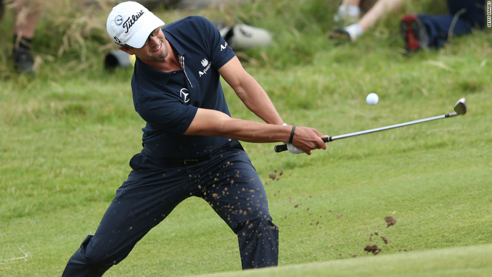 Adam Scott plays a bunker shot on the 15th hole Sunday.