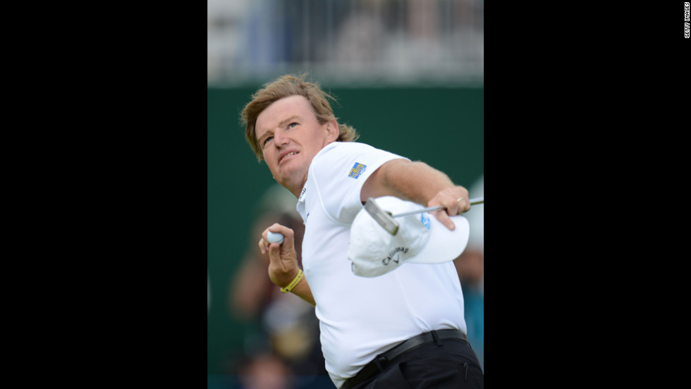 Ernie Els tosses his golf ball to the gallery after a birdie putt on the 18th green on Sunday.