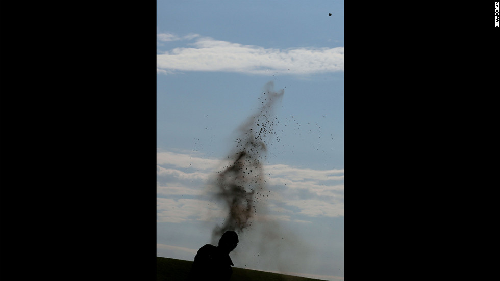 Rory McIlroy of Northern Ireland plays out of a bunker on the 10th hole Sunday.