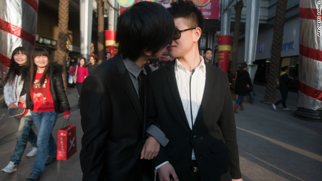 In a picture taken on March 8, 2011, a gay couple kiss during their ceremonial &#39;wedding&#39; in Wuhan, China.