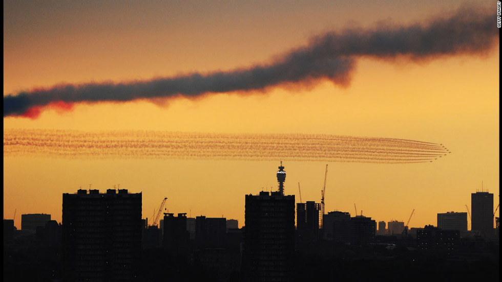 The Red Arrows disappear over London ahead of the opening ceremony.