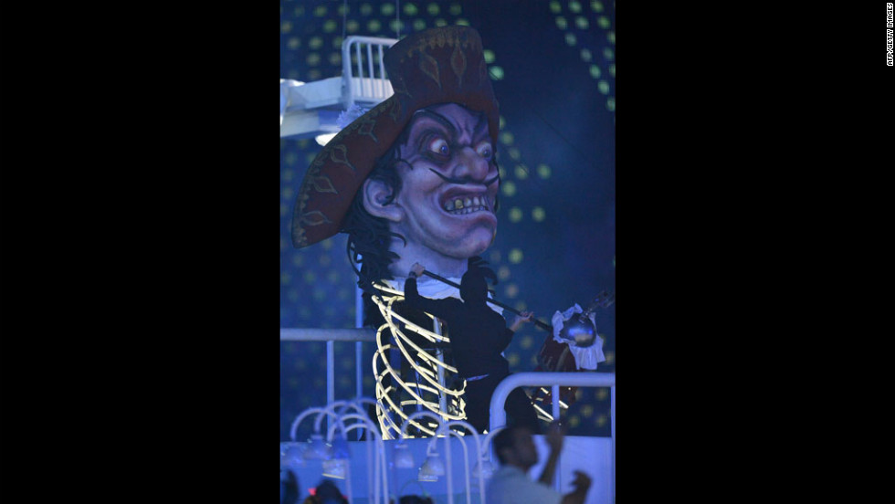 Giant pictures depicting villains of British literature, including Captain Hook from &quot;Peter Pan,&quot; are displayed during the opening ceremony.