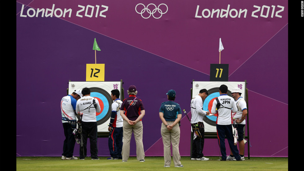 Competitors inspect targets Friday during the Archery Ranking Round at the Lord&#39;s Cricket Ground in London.