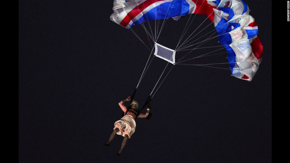 An actor dressed to resemble Britain&#39;s Queen Elizabeth II parachutes into the stadium during the opening ceremony.