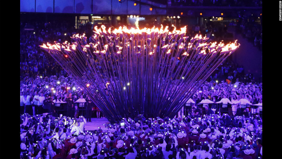 The individual torches rise up to form and engulf the cauldron in fire. 