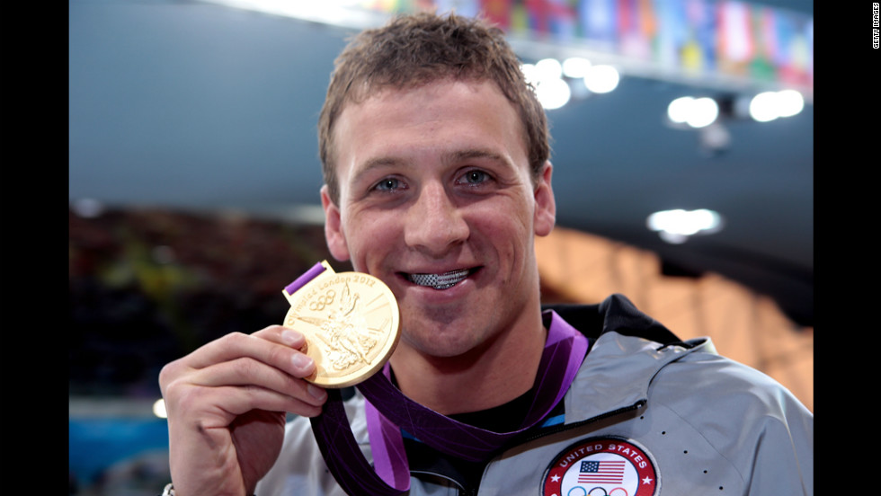 Ryan Lochte celebrates with his gold medal during the men&#39;s 400-meter individual medley medal ceremony on Saturday. He captured the first U.S. gold medal of the Games.