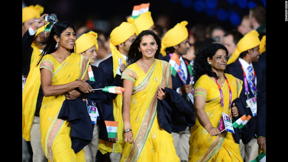 Members of India&#39;s delegation parade in the opening ceremony.