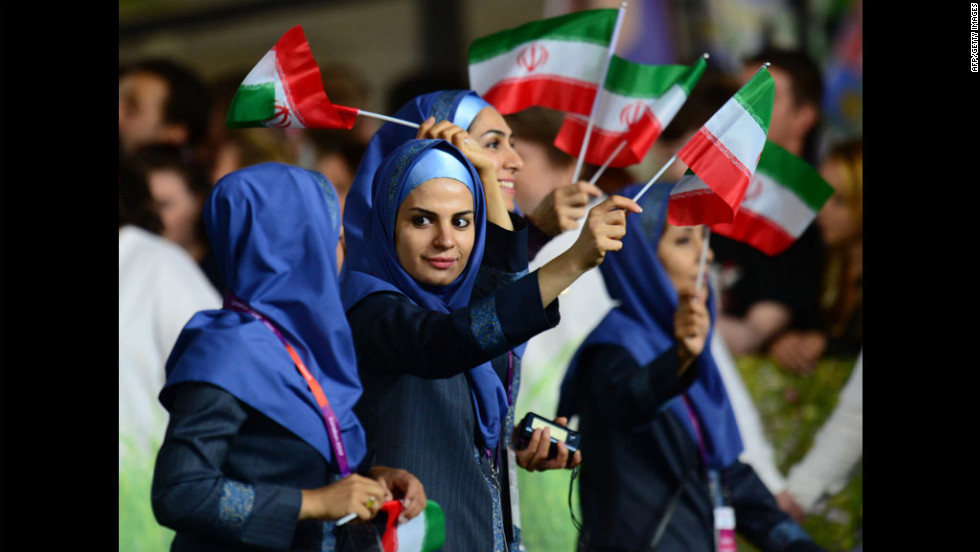 Members of Iran&#39;s delegation parade during the opening ceremony.