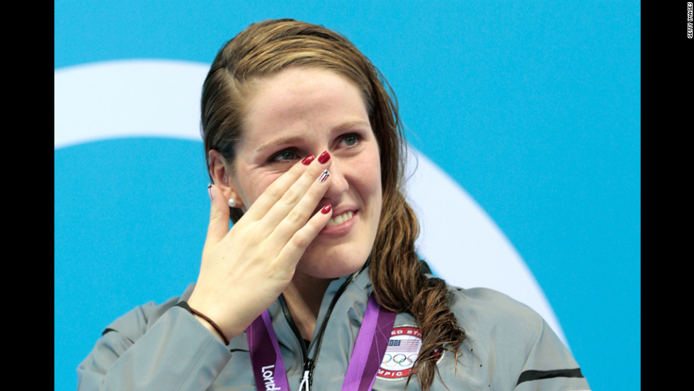 Missy Franklin of the United States wipes a tear from her face as she reacts during the medal ceremony for the women&#39;s 100-meter backstroke on Monday.