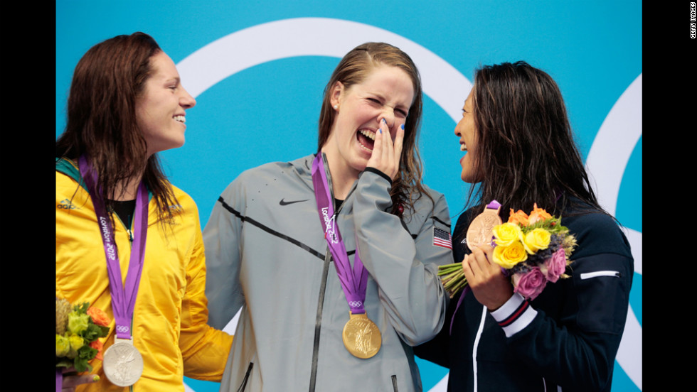 From left, silver medalist Emily Seebohm of Australia, gold medalist Missy Franklin of the United States and bronze medalist Aya Terakawa of Japan celebrate with their medals during the medal ceremony for the women&#39;s 100-meter backstroke on Monday.