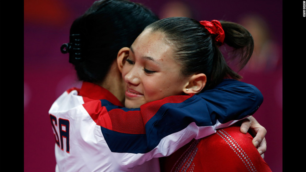 American Kyla Ross and coach Jenny Zhang hug during the women&#39;s gymnastics team final Tuesday.