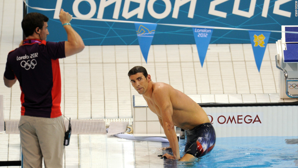 Phelps climbs out of the pool in London after a shock fourth-place finish in the 400-meter medley.