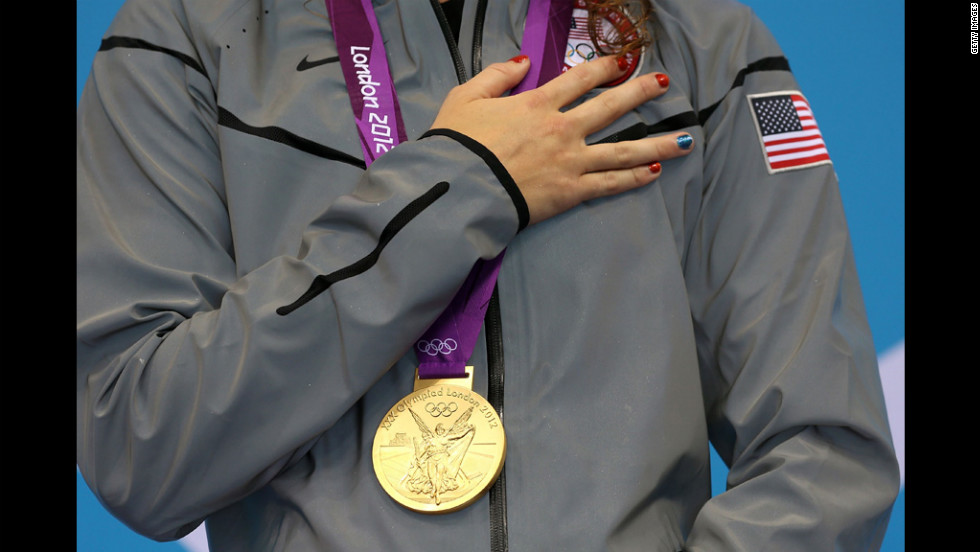 Gold medalist Allison Schmitt poses with her medal. 