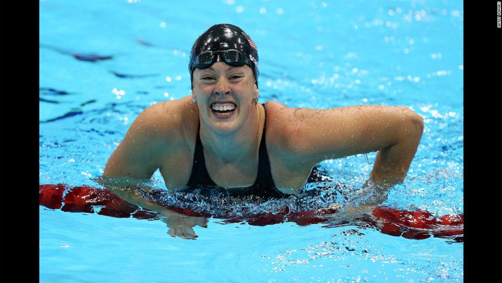 Allison Schmitt celebrates in the water after winning the gold.