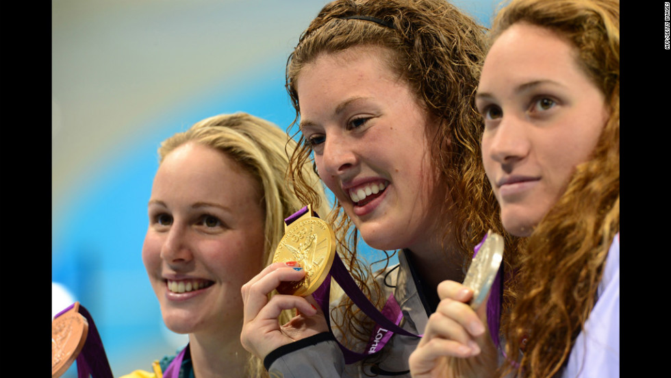 Gold medalist  Allison Schmitt, center, silver medalist Camille Muffat of France, right, and bronze medalist Bronte Barratt of Australia smile on the podium after the women&#39;s 200-meter freestyle final on Tuesday. 