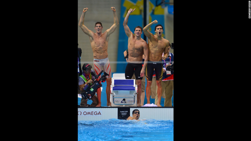 U.S. swimmers Ryan Lochte, center, Conor Dwyer, left, Ricky Berens, right, and Michael Phelps, in the water, react after their win.