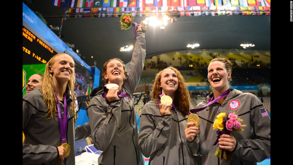 U.S. gold medalists, from left, Dana Vollmer, Allison Schmitt, Shannon Vreeland and Missy Franklin celebrate on the podium after winning the women&#39;s 4x200-meter freestyle relay on Wednesday.