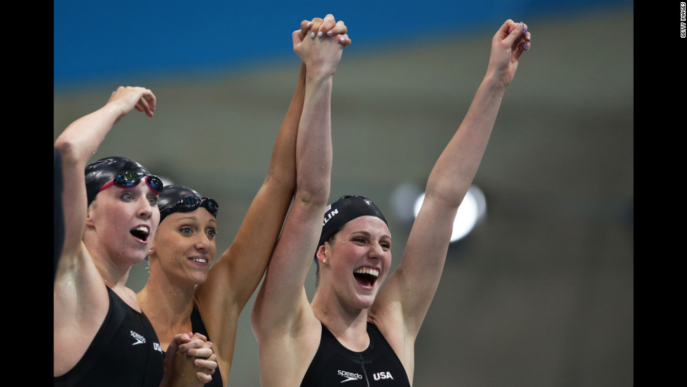 The U.S. women&#39;s swim team reacts to their victory over Australia.