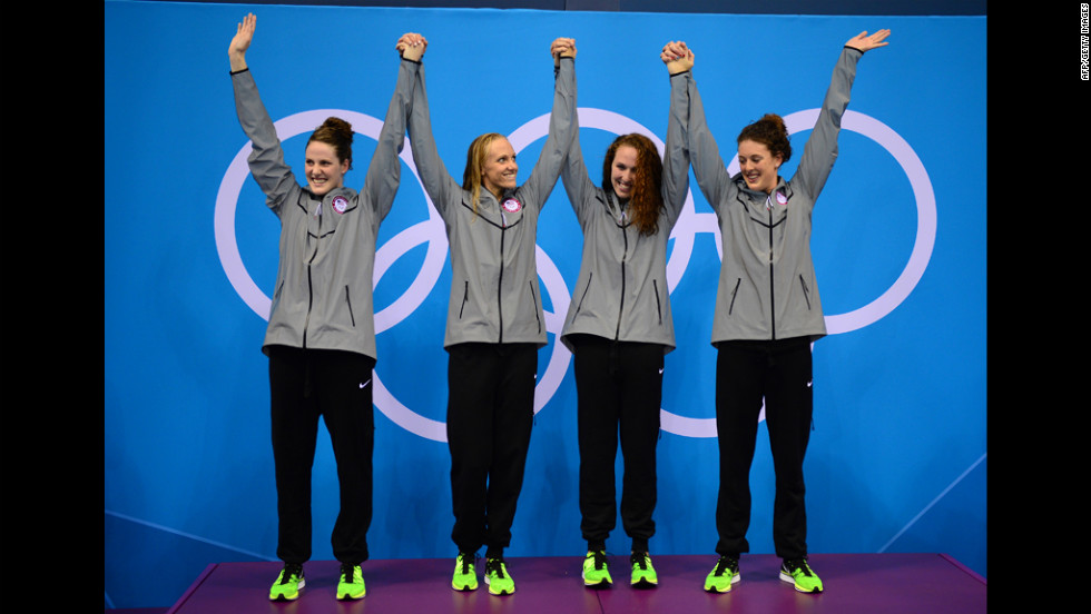 Missy Franklin, Dana Vollmer, Shannon Vreeland and Allison Schmitt celebrate on the podium after taking the gold in the women&#39;s 4x200-meter freestyle relay on Wedesnday. It was the United States&#39; eighth gold in swimming.