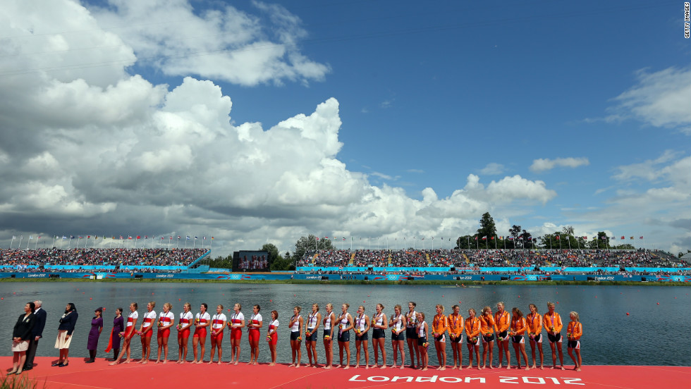 Members of the gold medal-winning U.S. team, the silver medal-winning Canadian team and the bronze medal-winning Dutch team line up during the medal ceremony.