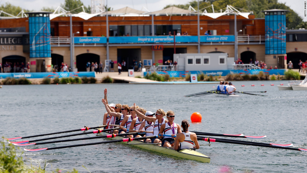 Wearing their gold medals, members of the U.S. team celebrate in their boat.