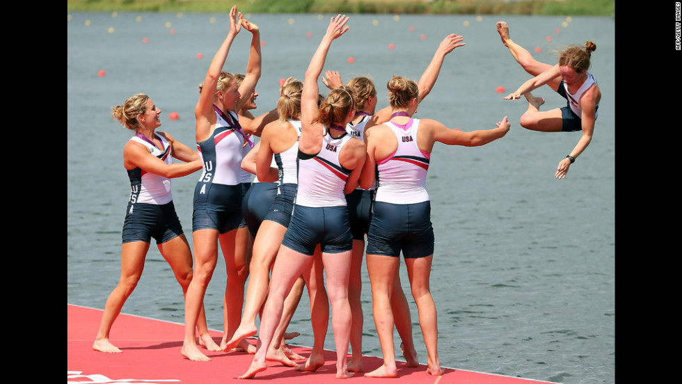 The U.S. team throws their cox Mary Whipple into the water after their big win.