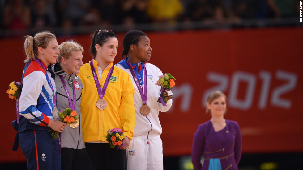 From left, Britain&#39;s silver medalist Gemma Gibbons, United States&#39; gold medalist Kayla Harrison, Brazil&#39;s bronze medalist Mayra Aguiar, and France&#39;s bronze medalist Audrey Tcheumeo, pose on the podium after the women&#39;s judo competition.